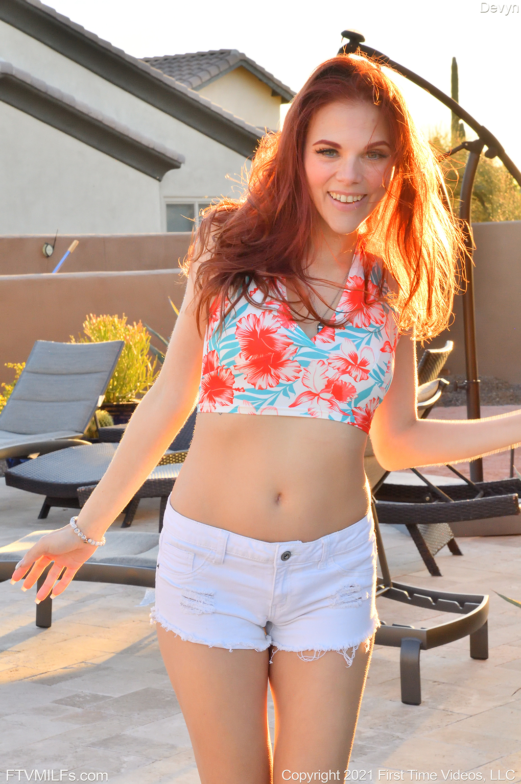 Redhead MILF Devyn Toying By The Pool picture