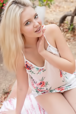 Nikoletas Wet Dress Clings, Showing Off Curves In The Garden Heat