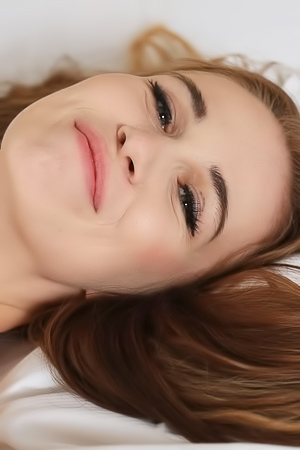 Nela Decker spreads legs on bed in sheer nightie